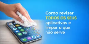 Mão limpando tela de smartphone com apps e fundo azul vibrante