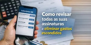 Mão segurando celular com conta de assinaturas e serviços visíveis em 2026